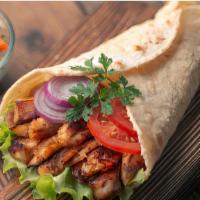 Arabic Chicken Shawarma Wrap · Chicken shawarma wrap with hot sauce and tahini sauce. Comes with a side of salad, fries and...