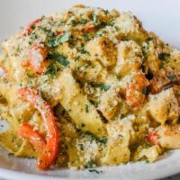 Chicken Pesto Pasta · sauteed chicken breast, pappardelle pasta, basil tomato mornay, parmesan, bell peppers, roas...