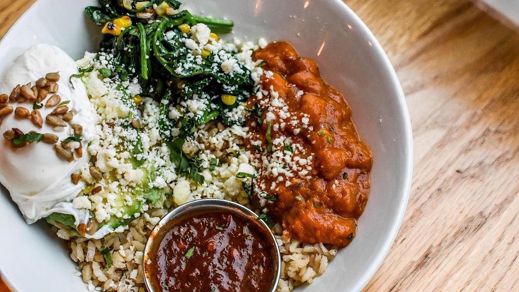 Breakfast Bowl. · brown rice, pinto beans, avocado, poached egg, spinach, charred corn, salsa roja, sunflower seeds, queso fresco (riced cauliflower substitute available)