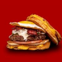 Breakfast Burger · Fried egg, beef bacon, Swiss cheese, grilled onions, green peppers, tomato, taystee sauce wi...