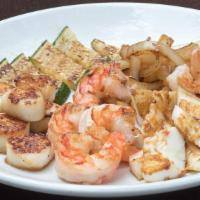 Surf Side · Grilled colossal shrimp, calamari, and tender sea scallops.