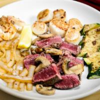 Land 'N Sea · Tender filet mignon and sea scallops grilled in butter and lemon.