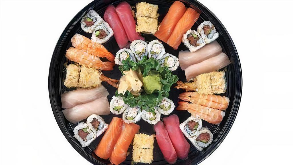 Emperor Platter · 1 Shrimp Crunchy Roll
1 California Roll
1 Spicy Tuna Roll
4 pcs. Tuna Nigiri
4 pcs. Salmon Nigiri
4 pcs. Yellowtail Nigiri
4 pcs. Shrimp Nigiri
