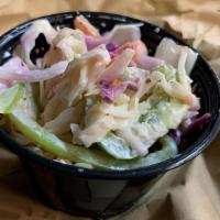 Creamy Cole Slaw · Filled with Red and Green Cabbage, Carrots, and Green Onions; lightly seasoned with Celery S...