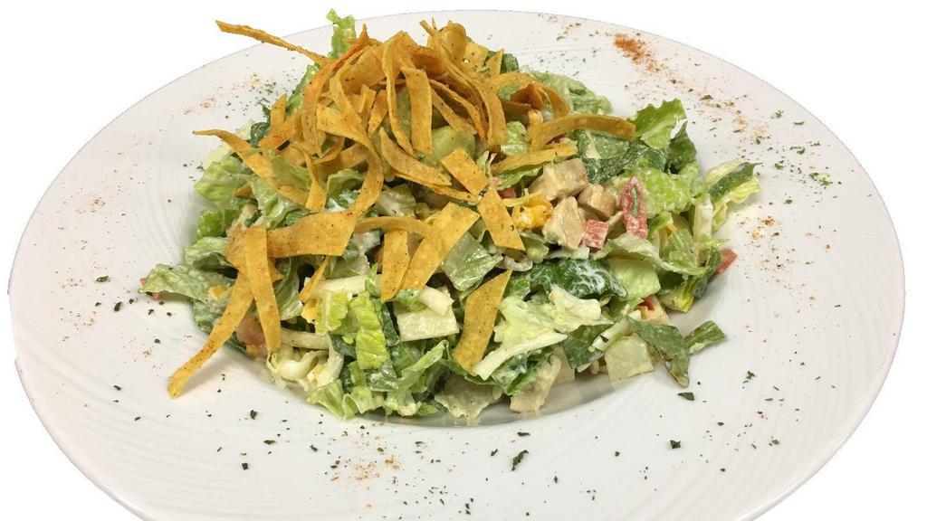 Southwest  Chicken Salad · Crisp romaine, chicken, tomatoes, green onions, red peppers and jack and cheddar cheese all chopped and tossed in a jalapeño ranch dressing then finished with crispy tortilla strips, and a scoop of guacamole.
