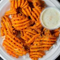 Buffalo Fries · Factory Fries Tossed in our buffalo sauce and served with a side of ranch dressing.
