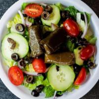 Mediterranean Greek Salad · Romaine lettuce, grape tomato, sweet red onion, cucumbers, black olives, and greek dolmades