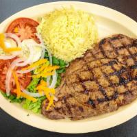 Ribeye Steak (12 Oz) · Ribeye steak, rice, house salad with dressing.