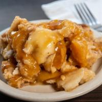 Peach Cobbler · Peaches marinated in love, butter crust and loving spices. Just like mom's. Best enjoyed war...