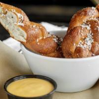 Fried German Pretzel · A fried german pretzel served with your choice of brown mustard or beer cheese sauce.