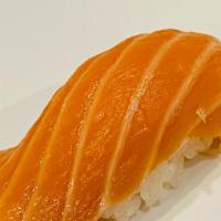 Salmon Nigiri · Salmon piece over sushi rice.