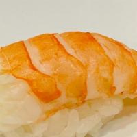 Shrimp (Ebi) Nigiri · Cooked shrimp over sushi rice.