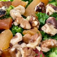 House Salad · Vegan. Lettuce, cucumber, tomato, parsley topped with dried apricot, walnuts and our house p...