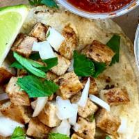 Chicken Taco · Double corn tortilla, grilled chicken with house dry spice rub, diced white onions, pulled c...
