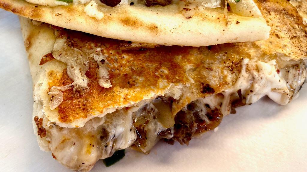 Beef Quesadilla · A blend of Oaxaca cheese, Provolone & Mozzarella, Mediterranean  grilled skirt steak, grilled diced onions & Poblano peppers inside 7