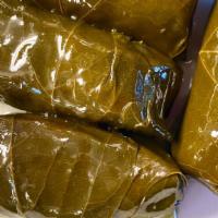 Stuffed Grape Leaves · Grape Leaves stuffed with rice, cooked in lemon and extra virgin olive oil. 5 large pcs.