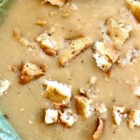 Lentil Soup · Yellow lentils cooked with onions, garlic & spices , cumin forward. Comes with pita croutons...