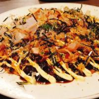 Okonomiyaki · Japanese seafood pancake.