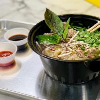 Pho Noodle · Dairy-free. Gluten-free. Vegan optional*  Rice noodles, green and red onion, cilantro, side ...