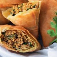 Meat Samosa (4Pcs) · Fried pastry with a savory filling of spiced beef and veggies.