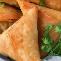 Veggie Samosa (4Pcs) · Fried pastry with a savory filling of spices & veggies