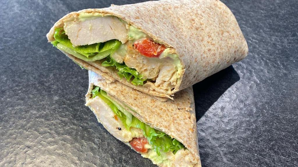 Roasted Turkey Wrap · Roasted turkey wrap with avocado cream cheese, roasted red peppers, and sweet lettuce.