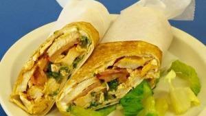 Moe'S Pita · Chicken breast sliced and rolled in a pita with hummus, tabouli, pickles, tomatoes and garli...