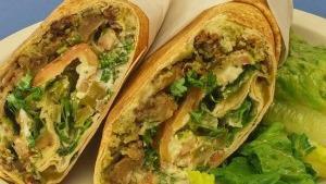 Kareemo Pita · Eggplant, falafel, hummus, tabouli and feta cheese rolled in a pita with lettuce, tomatoes, ...