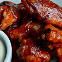 Classic Bbq · 8 traditional wings tossed in BBQ (mild heat), served with carrots and celery and a dipping ...