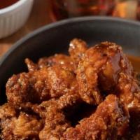 Classic Bbq · 8 boneless wings tossed in BBQ (mild heat), served with carrots and celery and a dipping sau...
