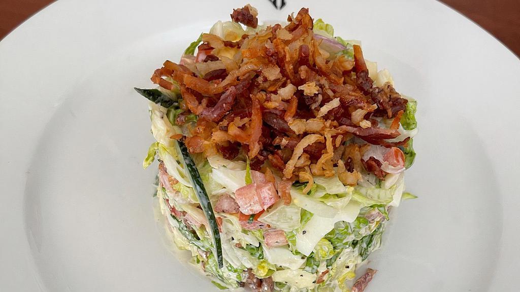 Double Chop Salad · Crispy pancetta, hard egg, julienned English cucumber, tomato, red onion, celery, buttermilk ranch, aged white cheddar, crispy onions