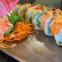 Chicago Roll  · Crabmeat, avocado, cucumber topped w/ yellowtail, salmon, avocado &  spicy mayo, hot sauce