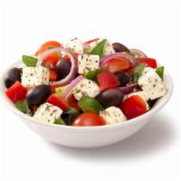 Greek Salad · Crisp greens and fresh tomatoes with tender gyro meat, tangy feta cheese, black olives and p...