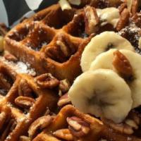 Banana Pecan Waffle · A thick golden brown waffle baked with fresh bananas and pecans.