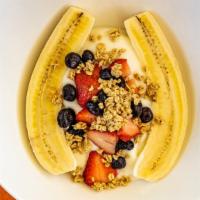 Breakfast Banana Split · Our signature banana split dish filled with layers of low-fat vanilla yogurt, crunchy granol...