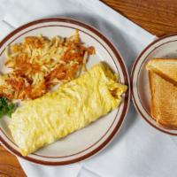 Western Omelette · Served with green peppers, onions, ham, tomatoes and cheese.