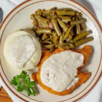 Chicken Fried Chicken · A delicious fried chicken breast covered with our famous sausage gravy with two farm fresh e...