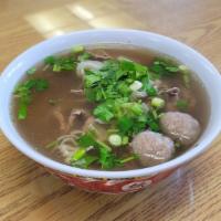 Pho - Beef Rice Noodle Soup · Thin slices of beef, meatballs and tripe in beef broth.
