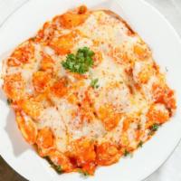 Baked Gnocchi With Vodka Sauce · Homemade pasta dumplings stuffed with ricotta tossed in our creamy vodka sauce baked with mo...