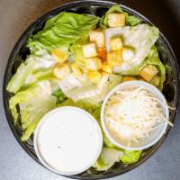 Caesar Salad · Freshly chopped romaine lettuce parmesan cheese croutons and caesar dressing.