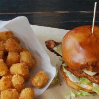 Chicken Sandwich · Panko crusted or grilled chicken breast, iceberg, mayonnaise, dill pickle and cold Swiss.