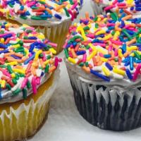 Vanilla Whipped Sprinkle Cupcakes  · 12 Yellow and Chocolate cupcakes with vanilla whip and sprinkles
