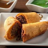 Mirch Pakora · Vegan and Gluten-free Chickpea dipped Banana Paper stuffed with Potatoes and Tamarind. 3 Pie...