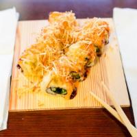 Cali Forest Roll · Deep fried California roll with eel sauce, spicy mayo, white sauce, potato crumb.