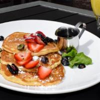 Griddle Pancakes · Berry compote, whipped butter, and warm maple syrup