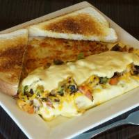 Garden Omelet · Tomatoes, onions, green peppers, mushrooms and cheese, covered with hollandaise sauce