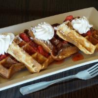 Strawberry Waffles · Topped with strawberries and whipped cream