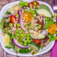 House Salad · Organic greens, cucumber, onion, peas, tomato, sunflower seeds, champagne vinaigrette.