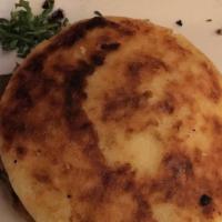Arepa Rellena · Traditional cheese-corn bread with either shredded chicken in mushroom sauce or pulled beef ...