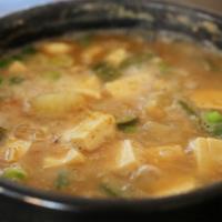 Doenjang Jjigae · Soybean paste stew with tofu, beef, and vegetables.